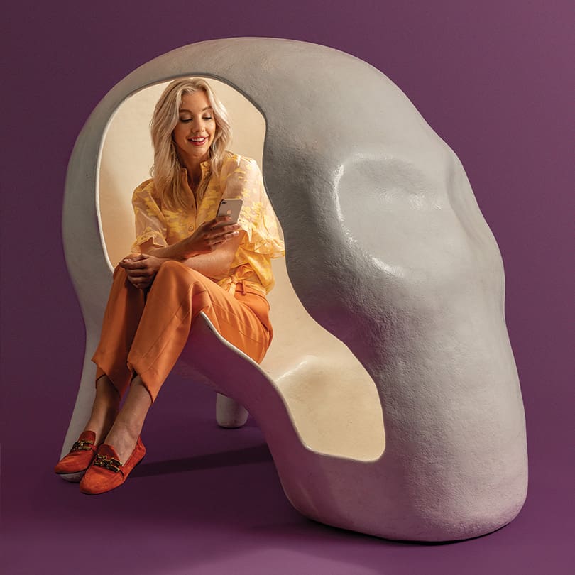 girl in a skull shaped chair made by 